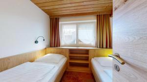 Postel nebo postele na pokoji v ubytování Landhaus Foidl + 37 fotografií