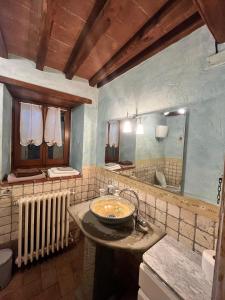 a bathroom with a sink and a mirror at Agriturismo D'ambiano in Arezzo +74 photos