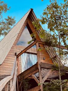 a tree house with a window on the side of it at Cabanas Bela Vista in Rolante