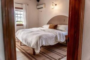 a bedroom with a bed and a window at Mont Vernon Villas in Cul de Sac +41 photos