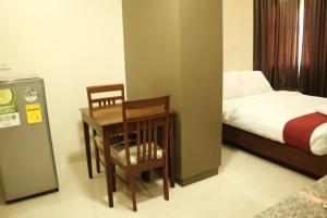 Uma cama ou camas num quarto em Sebastien Hotel