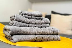 a stack of towels sitting on top of a table at Quirky Studio in Central Reading in Reading