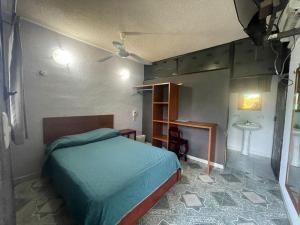 Postel nebo postele na pokoji v ubytování Hotel Lol Tun