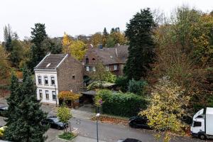 a white van parked in front of a house at Gemütliches Wohnen in Düren in Düren - Eifel