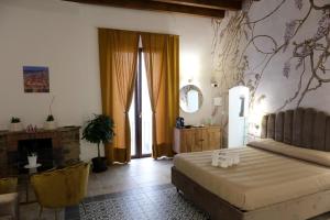 Postel nebo postele na pokoji v ubytování Palazzo Matilde