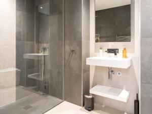 a bathroom with a shower and a sink at Arran Shores Luxury Shorefront Penthouse Suite 10 in Lamlash +25 photos