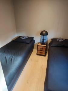 Postel nebo postele na pokoji v ubytování Natuurchalet Hellendoorn met Hottube!