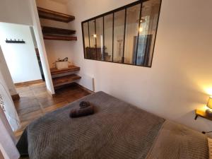 a bedroom with a bed and a mirror on the wall at Prestigieuse Résidence ST MARIE - N 22 in Bellac
