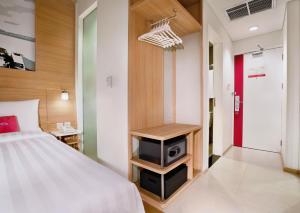 Postel nebo postele na pokoji v ubytování favehotel Palembang