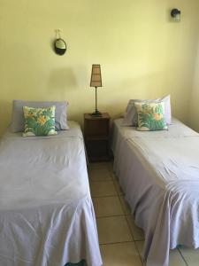 A bed or beds in a room at Private Room with Twin Beds AC nr Intl Airpt and Beach