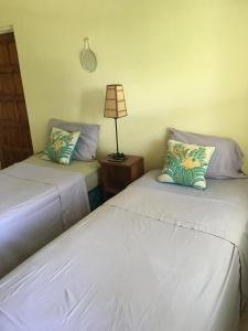 A bed or beds in a room at Private Room with Twin Beds AC nr Intl Airpt and Beach