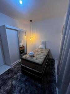 En eller flere senge i et værelse på Cantinho da Lagoa - Iguaba Grande