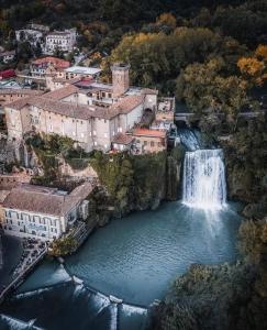 an aerial view of a town with a waterfall at Gismondi B&B in Sora +6 photos