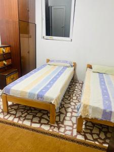 Postel nebo postele na pokoji v ubytování Nina Apartments