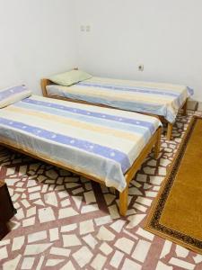 Postel nebo postele na pokoji v ubytování Nina Apartments