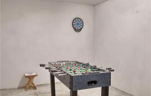 a chess board on a table in a room with a clock at Villa Montreo in Muntrilj