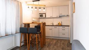 Kuchyň nebo kuchyňský kout v ubytování Apartment Olsa - Cozy Studio in Kandersteg