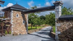an entrance to a stone building with an archway at loft oppidum in Theux