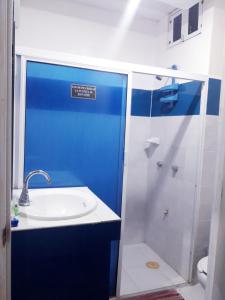 a bathroom with a sink and a shower at Teresita Marina in Campeche