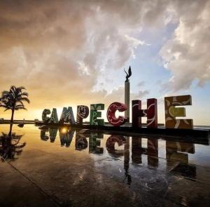 a large sign that says alamed city in front of a sunset at Teresita Marina in Campeche