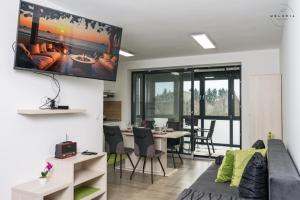 a living room with a couch and a table at Meloria Apartments in Veržej