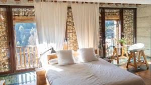 A bed or beds in a room at Loft Rural LaCalata