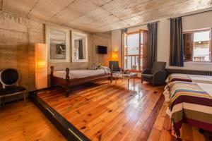 A bed or beds in a room at Loft Rural LaCalata
