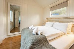 Postel nebo postele na pokoji v ubytování Ramberg Resort