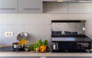 a kitchen with a counter with fruits and vegetables on it at Villa Vittorio in Rovinj