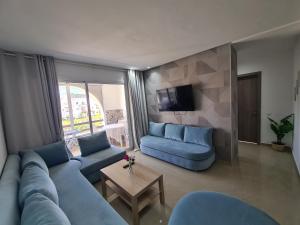 Posezení v ubytování Charmant appartement en résidence piscine