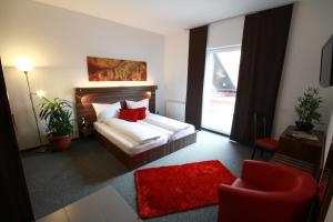 Postel nebo postele na pokoji v ubytování Hotel Fabrik Vösendorf + 21 fotografií