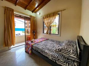 Postel nebo postele na pokoji v ubytování Central y Cómoda casa San Rafael Wifi y Balcón + 33 fotografií