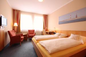 Postel nebo postele na pokoji v ubytování Hotel Hanken GmbH, Hotel Hanken und Seehotel