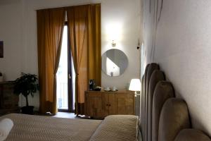 Postel nebo postele na pokoji v ubytování Palazzo Matilde