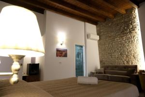 Postel nebo postele na pokoji v ubytování Palazzo Matilde