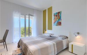Ένα ή περισσότερα κρεβάτια σε δωμάτιο στο Villa Debora