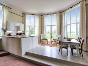 a kitchen and dining room with a table and chairs at Stargazers - Uk3445 in Greenhaugh