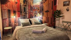 a bedroom with a large bed in a city at Petit Palais Vénitien in Roubaix