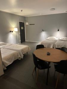 Postel nebo postele na pokoji v ubytování Hotell Salem