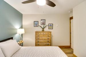 a bedroom with a bed and a ceiling fan at 5 Mi to Whitefish Resort Minutes to Chairlifts! in Whitefish