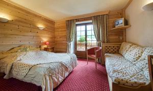 Postel nebo postele na pokoji v ubytování Hotel les Sapins