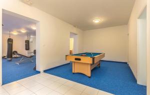 a room with a pool table and a treadmill at Holiday Home Sopaljska Cr in Crikvenica