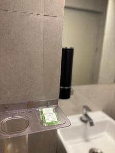 a bathroom with a sink and a mirror at Terracotta Trails-1 Bedroom with Living room in Varanasi