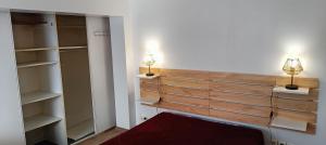 a room with two lights on the wall and a closet at Studio indépendant de plain pied agréé Chèques Vacances in Drancy