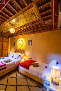 Postel nebo postele na pokoji v ubytování Riad Almonds Marrakech
