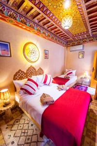 Postel nebo postele na pokoji v ubytování Riad Almonds Marrakech