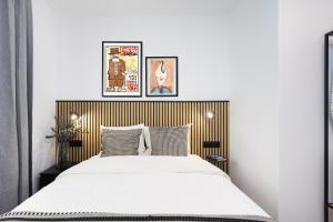 Ένα ή περισσότερα κρεβάτια σε δωμάτιο στο Suites Rooms La Rosa