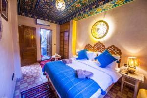 Postel nebo postele na pokoji v ubytování Riad Almonds Marrakech
