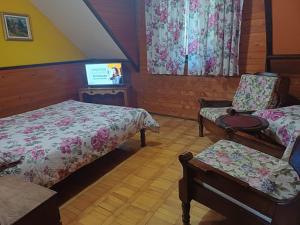 Rúm í herbergi á Guest House Alpska Vila