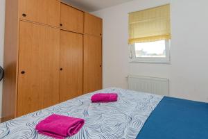 Ένα ή περισσότερα κρεβάτια σε δωμάτιο στο Apartments Markovic